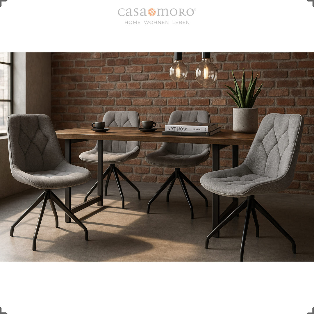 Quatre chaises de salle à manger grises avec fonction pivotante à 360° et structure en métal noir - coin repas moderne avec table en bois et caractère loft industriel